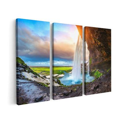 Canvas schilderij drieluik Waterval Van Een Klif Bij Zonsondergang