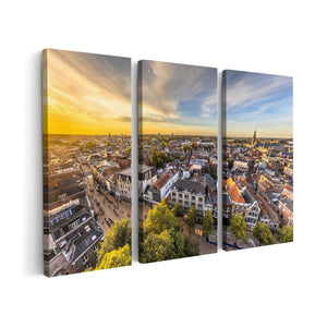 Canvas schilderij drieluik Groningen Skyline Stad bij Zonsondergang