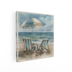 Canvas schilderij vierkant Twee Stoelen op het Strand met een Parasol