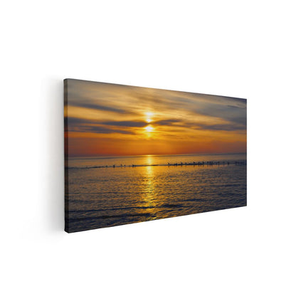 Canvas schilderij vooraanzicht Zonsondergang In De Zee