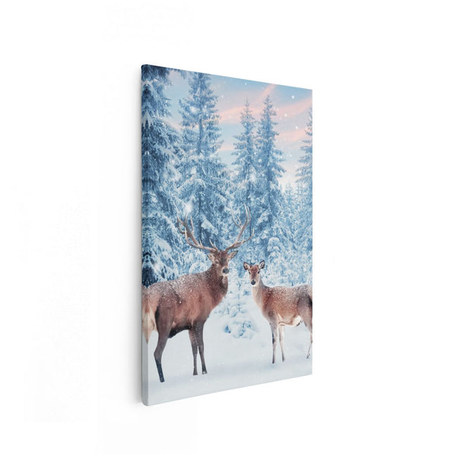 Canvas schilderij vooraanzicht Twee Herten In Het Bos Met Sneeuw