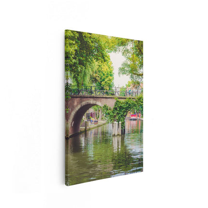 Canvas schilderij vooraanzicht Dichtbegroeide Brug Op De Oudegracht In Utrecht