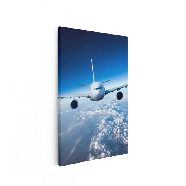 Canvas schilderij vooraanzicht Vliegtuig In De Wolken