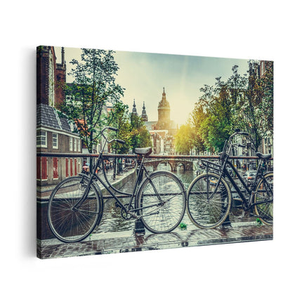 Canvas schilderij vooraanzicht Amsterdamse Brug Bij Een Gracht Met Zonsondergang