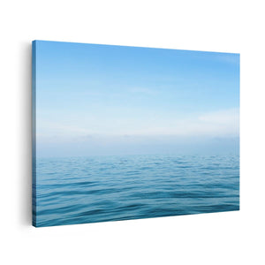 Canvas schilderij vooraanzicht Zee Met Een Blauw Hemel Achtergrond