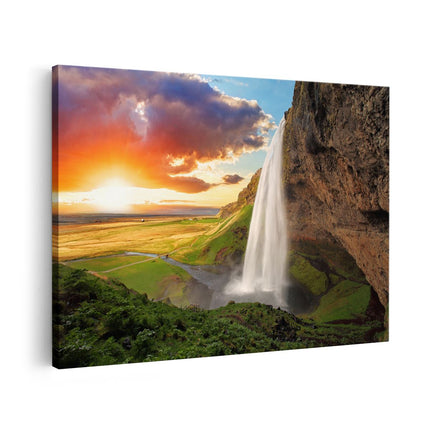 Canvas schilderij vooraanzicht Waterval In IJsland Met Zonsondergang