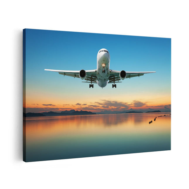 Canvas schilderij vooraanzicht Vliegtuig Vliegt Boven Een Kleurrijke Zee