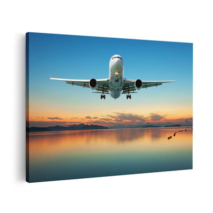 Canvas schilderij vooraanzicht Vliegtuig Vliegt Boven Een Kleurrijke Zee