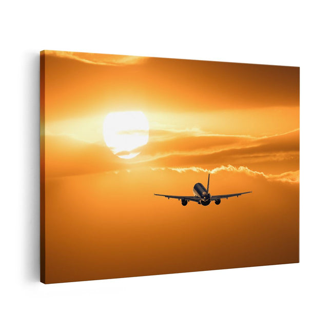 Canvas schilderij vooraanzicht Vliegtuig Bij Zonsondergang