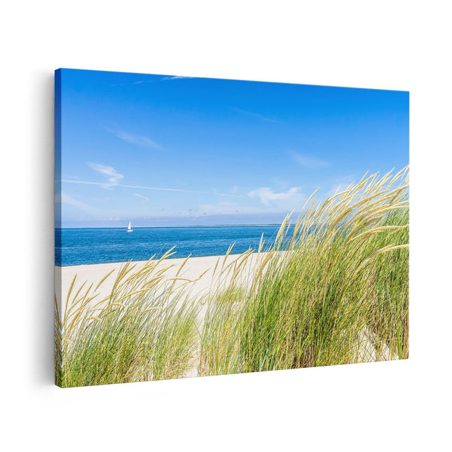 Canvas schilderij vooraanzicht Strand en Zee met een Zeilboot