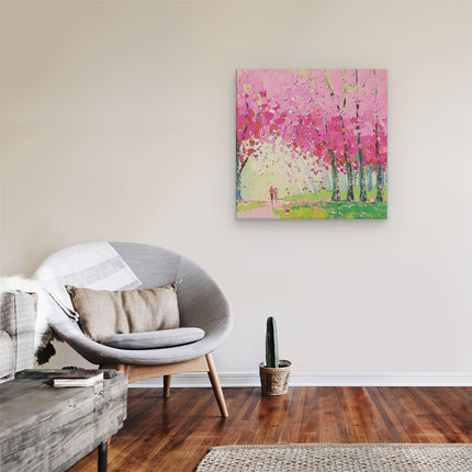 Canvas schilderij kamer Kunstwerk van een Stel dat door Roze Bloeiende Bomen loopt