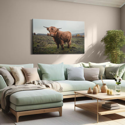 Canvas schilderij woonkamer Schotse Hooglanders in het Veld