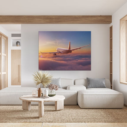 Canvas Schilderij Woonkamer Vliegtuig In De Wolken Bij Zonsondergang