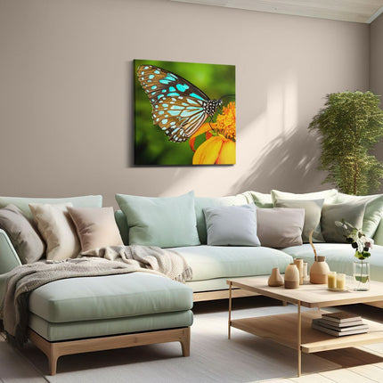 Canvas schilderij woonkamer Blauwe Vlinder Bij Een Oranje Bloem