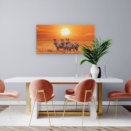 Canvas schilderij woonkamer Drie Zebra's Bij Zonsondergang