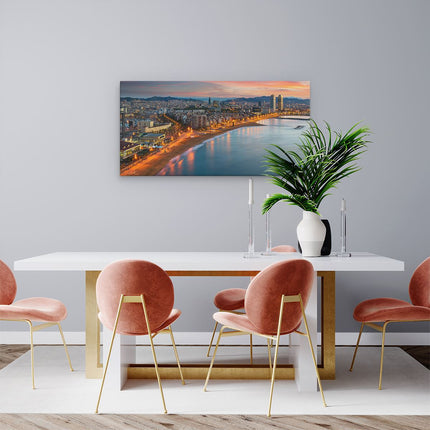 Canvas schilderij woonkamer Barcelona Strand met Stad bij Zonsondergang