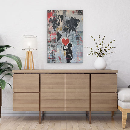 Canvas schilderij interieur Jongen Houdt een Rood Hart voor een Wereldkaart