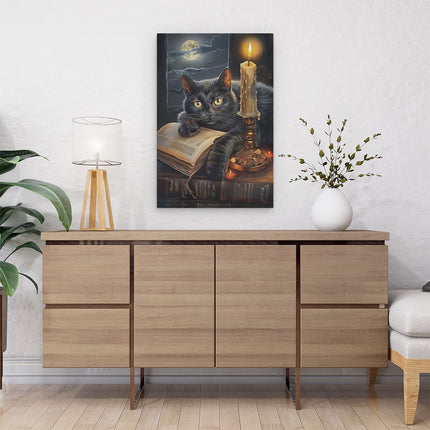 Canvas schilderij interieur Zwarte Kat die op een Boek ligt met een Kaars