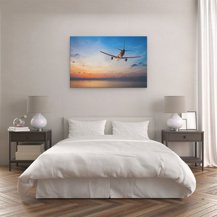 Canvas schilderij slaapkamer Vliegtuig Boven De Zee Bij Zonsondergang