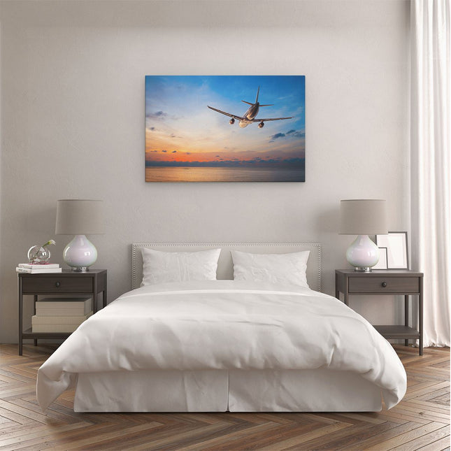 Canvas schilderij slaapkamer Vliegtuig Boven De Zee Bij Zonsondergang