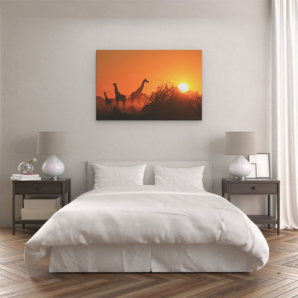 Canvas schilderij slaapkamer Drie Giraffe Silhouetten Bij Zonsondergang