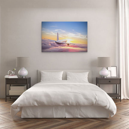 Canvas schilderij slaapkamer Vliegtuig In De Wolken Bij Zonsondergang