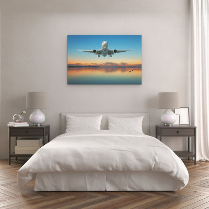 Canvas schilderij slaapkamer Vliegtuig Vliegt Boven Een Kleurrijke Zee