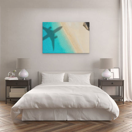 Canvas schilderij slaapkamer Silhouet Van Een Vliegtuig Op Het Strand