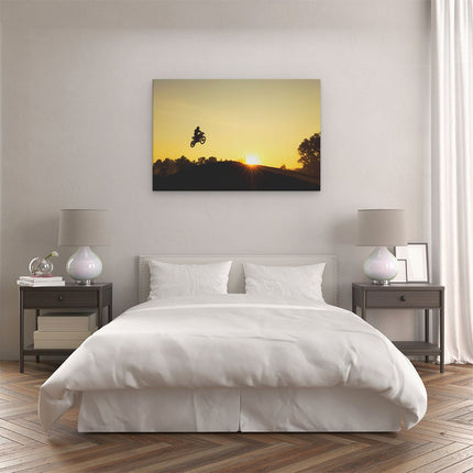 Canvas schilderij slaapkamer Silhouet Van Een Motorcross Bij Zonsondergang