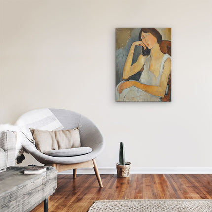 Canvas Schilderij Kamer Vrouw Zittend in een Stoel met haar Hand op haar Kin