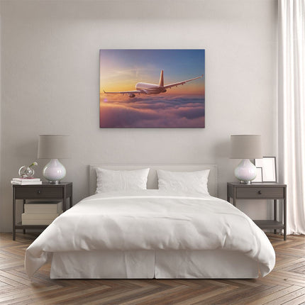 Canvas Schilderij Slaapkamer Vliegtuig In De Wolken Bij Zonsondergang