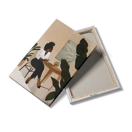 Canvas schilderij details Zwarte Vrouw zit aan een Bureau voor een Plant