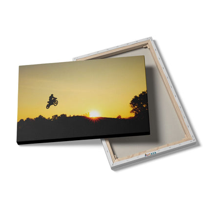 Canvas schilderij details Silhouet Van Een Motorcross Bij Zonsondergang