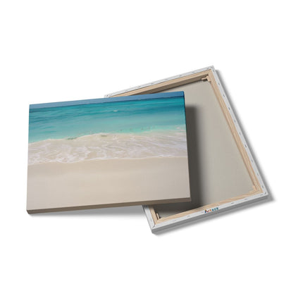 Canvas Schilderij Details Wit Zandstrand met Blauw Water