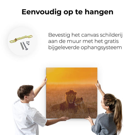 Canvas schilderij ophangen Leeuw En Leeuwin Tijdens Zonsondergang