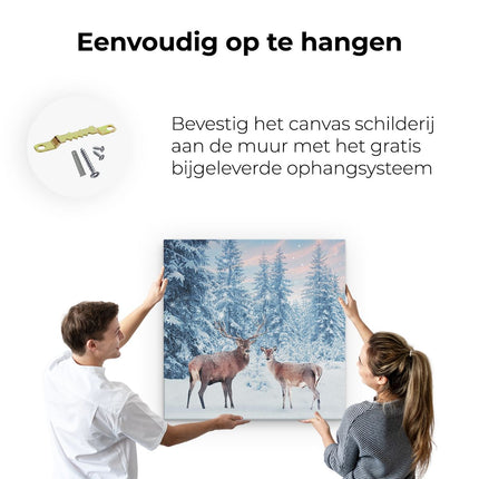 Canvas schilderij ophangen Twee Herten In Het Bos Met Sneeuw