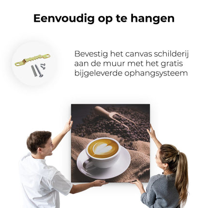 Canvas schilderij ophangen Kopje Koffie In Een Hartje Met Koffiebonen