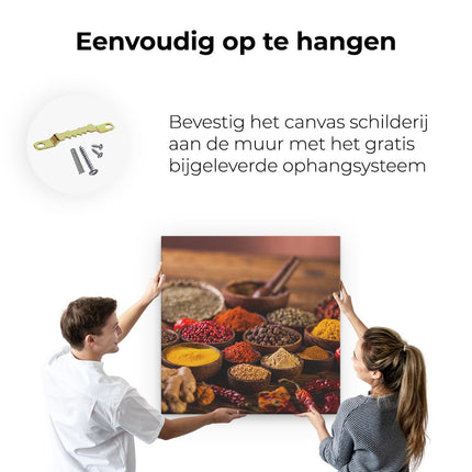 Canvas schilderij ophangen Diverse Kleurrijke Kruiden Op Tafel