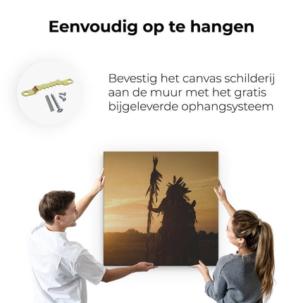 Canvas schilderij ophangen Indiaan met een Speer bij Zonsondergang