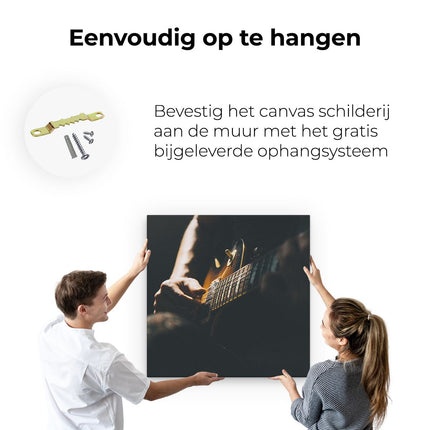 Canvas schilderij ophangen Man Speelt Gitaar