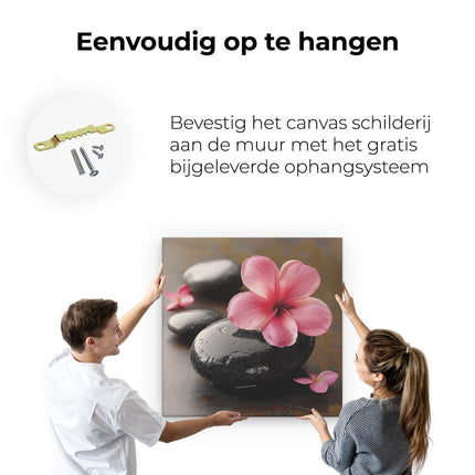 Canvas schilderij ophangen Zwarte Stenen met een Roze Bloem