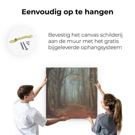 Canvas schilderij ophangen Pad door een Mistig Bos
