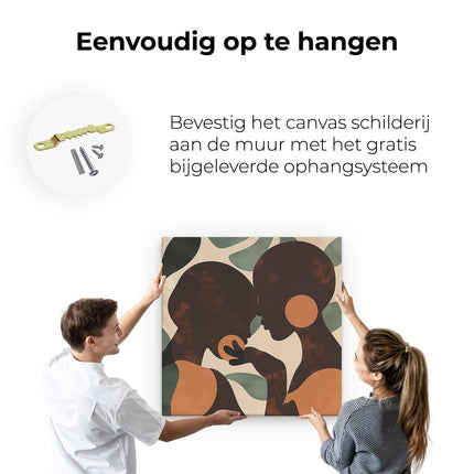 Canvas schilderij ophangen Twee Silhouetten van Vrouwen die Elkaar Kussen