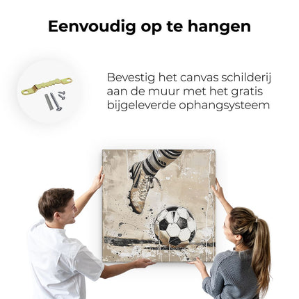 Canvas schilderij ophangen Voetbalspeler Trapt een Bal