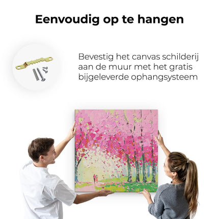 Canvas schilderij ophangen Kunstwerk van een Stel dat door Roze Bloeiende Bomen loopt