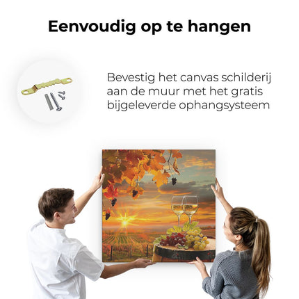 Canvas schilderij ophangen Twee Glazen Wijn en Druiven op een Vat bij Zonsondergang