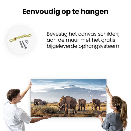 Canvas schilderij ophangen Groep Olifanten Lopen Voor De Bergen