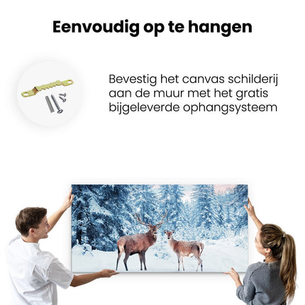 Canvas schilderij ophangen Twee Herten In Het Bos Met Sneeuw