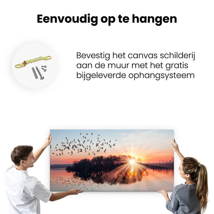 Canvas schilderij ophangen Groep Vogels Boven De Meer Met Zonsondergang