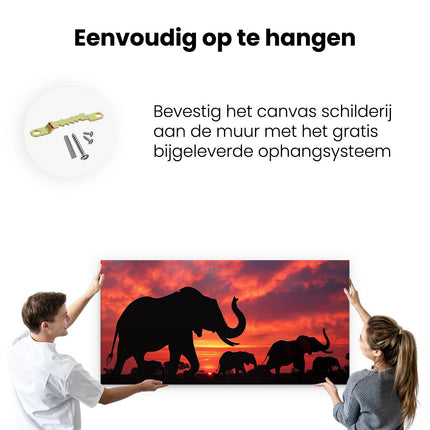 Canvas schilderij ophangen Silhouetten van Olifanten bij Zonsondergang